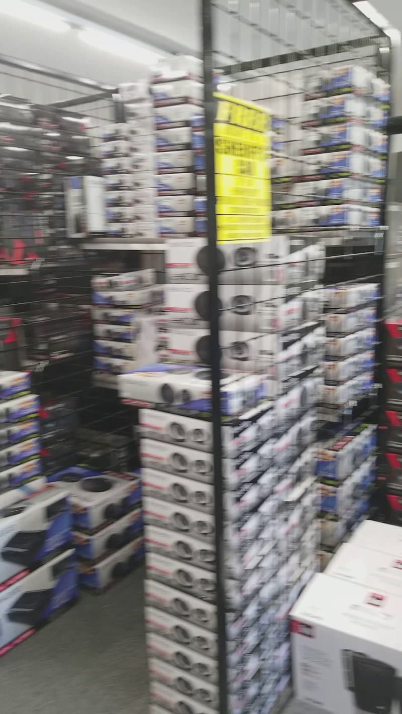 Tall wire rack of speaker boxes in a store at Sonny's Audio & Video in Opelousas, Louisiana