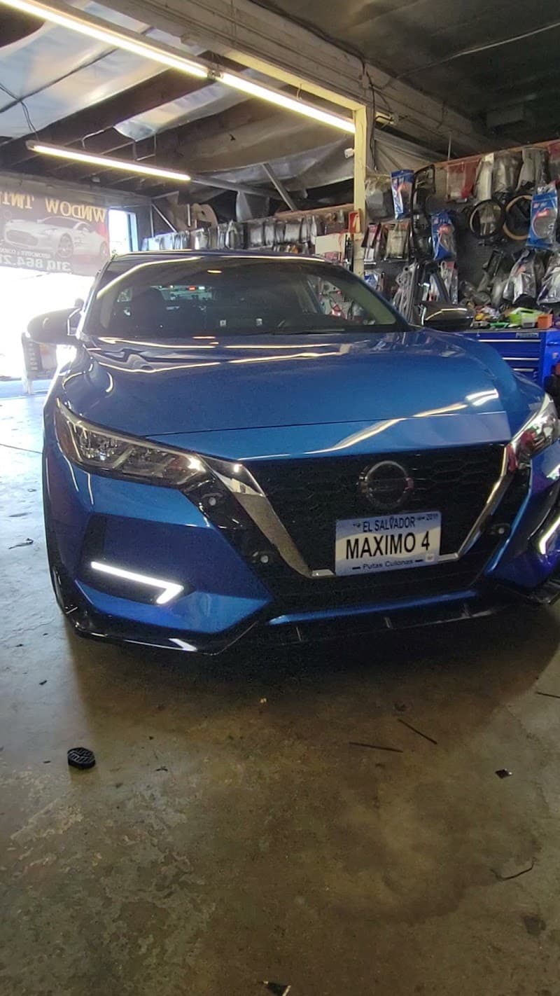 Blue Nissan parked inside shop bay at Segura Sounds in Hawthorne, California