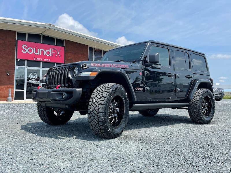 Black Jeep Rubicon parked outside storefront at Sound FX Paint Protection Film, Window Tint, & Car Audio in Lewes, Delaware