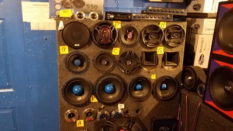 Speaker display board with lettered yellow labels on wall at Jake's Discount Car Stereo in Reading, Pennsylvania