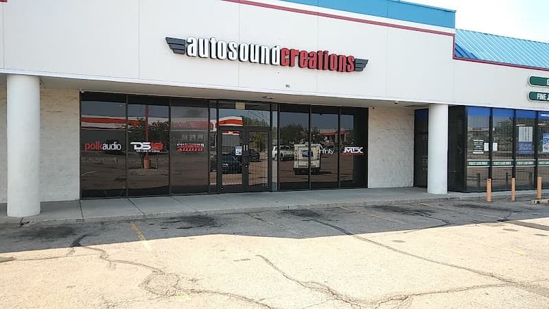 Storefront with Polk Audio and MTX window decals at Autosound Creations in Colorado Springs, Colorado
