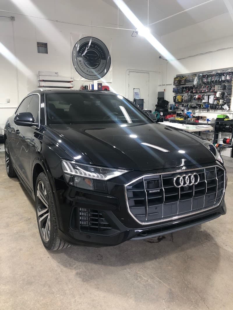 Black Audi SUV parked in a shop bay at Matsu Auto Electric in Palmer, Alaska