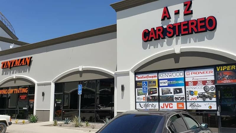Storefront with red letter sign and car audio brand decals in window at A to Z Car Stereo in Murrieta, California