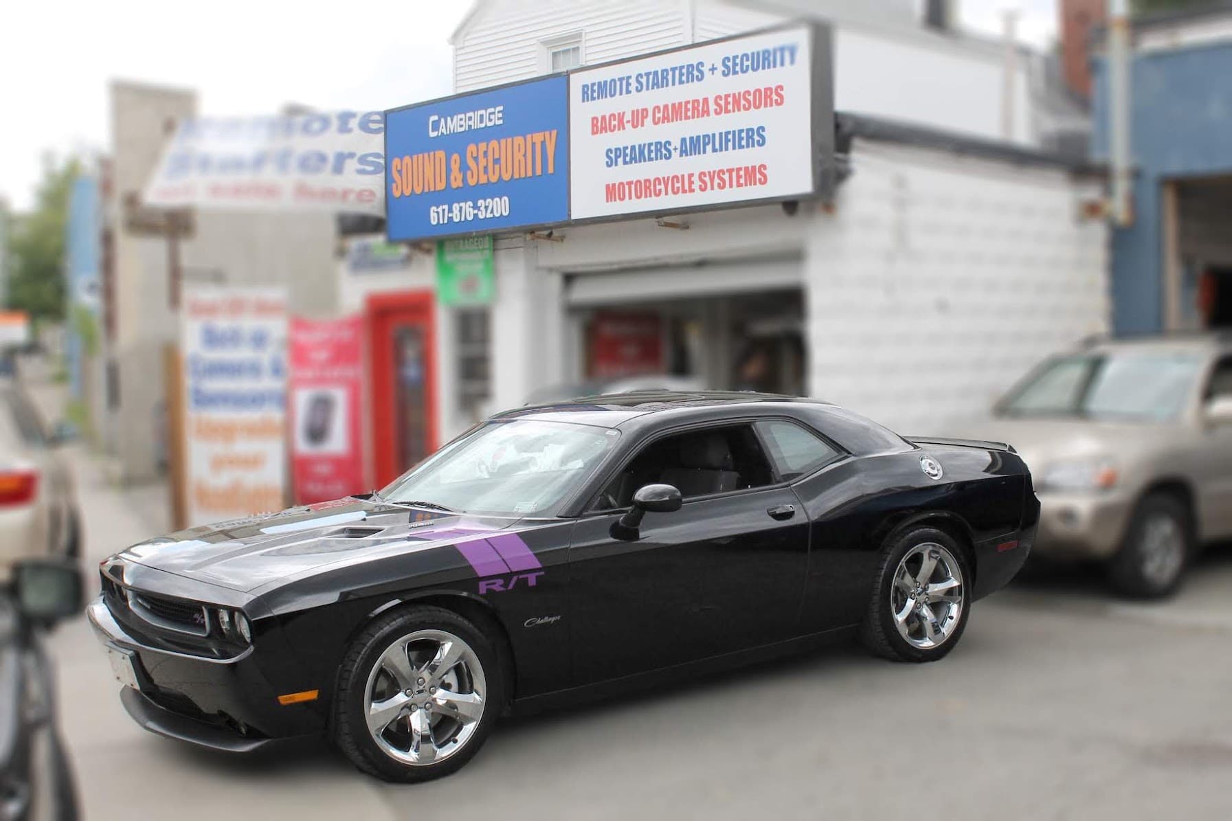 Black Challenger R/T coupe parked outside a shop at Cambridge Sound and Security in Cambridge, Massachusetts