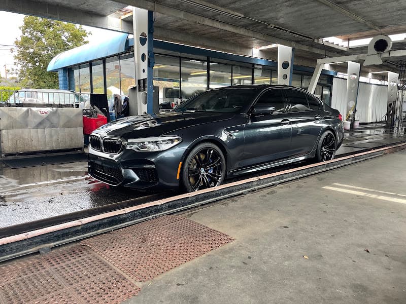 Dark gray sedan on a car wash track at All Points Automotive, Inc. in Redondo Beach, California