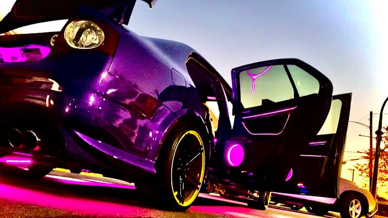 Purple car with pink underglow and open door at Car Audio Pittsburgh - Cazillia Audio in Pittsburgh, Pennsylvania
