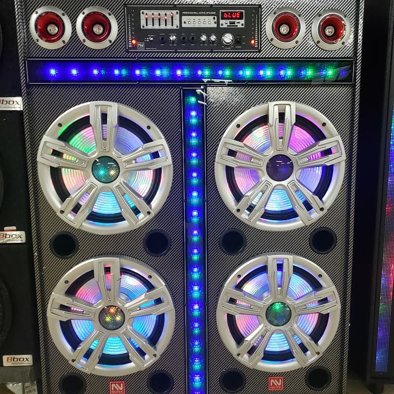Tall speaker cabinet with four woofers and LED light strips at Solid Sound Electronics in Chicago, Illinois