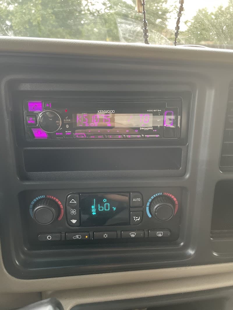 Kenwood KDC-BT34 car radio with pink display and climate panel at Ground Gear Performance in Aurora, Colorado