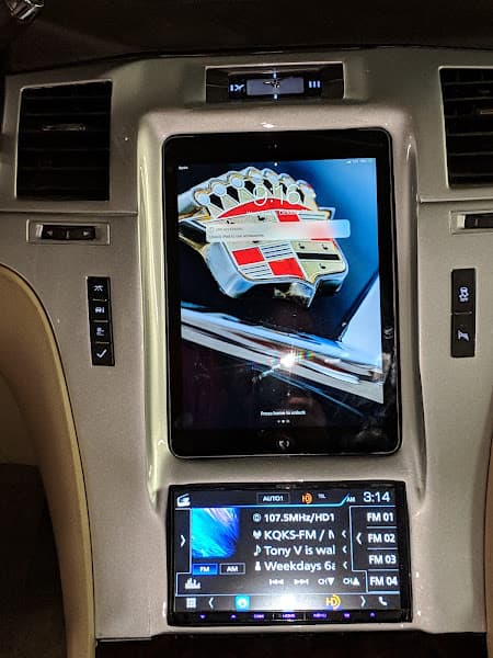 Tablet mounted in dashboard showing a Cadillac crest above a stereo at 12volt mobile in Denver, Colorado