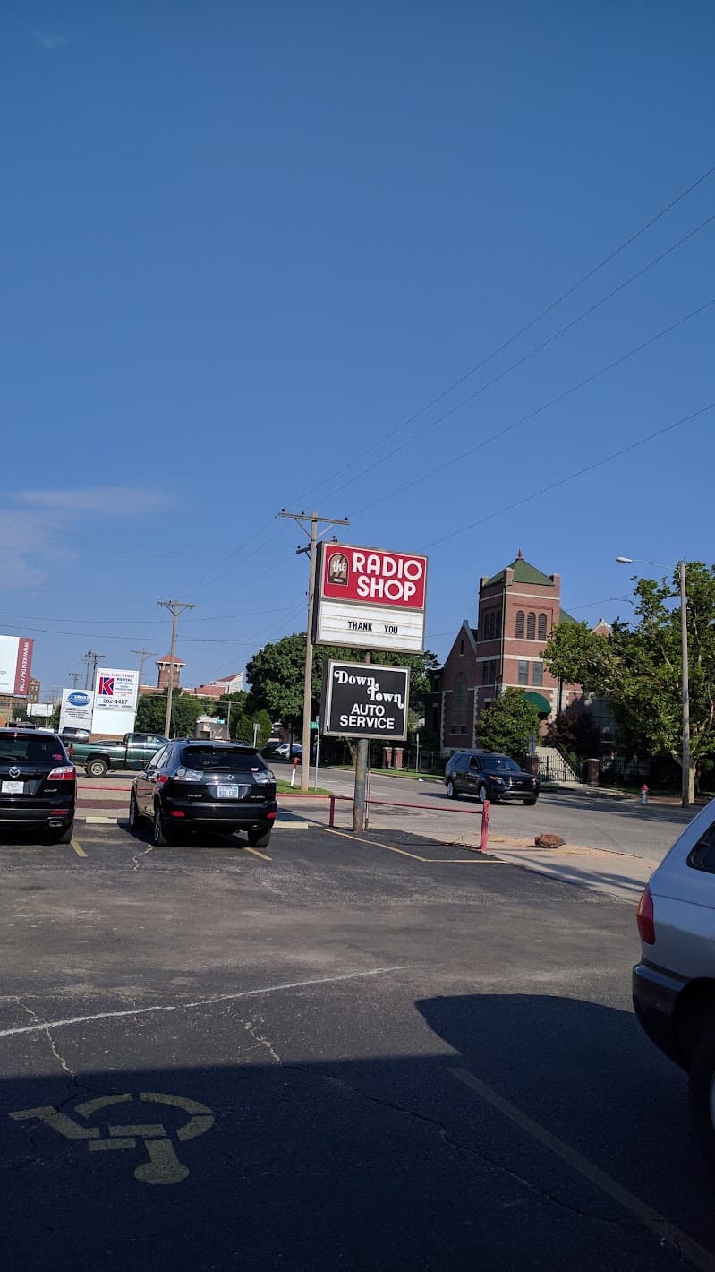 Two pole signs above a parking lot at The Radio Shop in Wichita, Kansas
