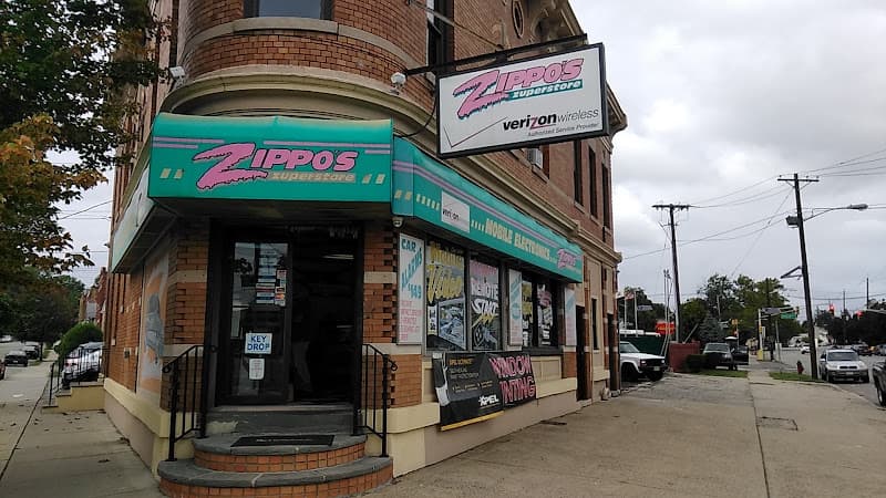 Brick corner storefront with teal awning and window signs at Zippo's Mobile Electronics in Belleville, New Jersey