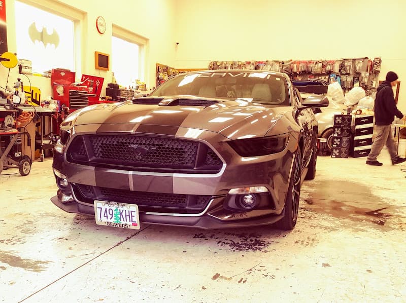 Gray coupe parked nose-first in a workshop at Superior Sound in Albany, Oregon