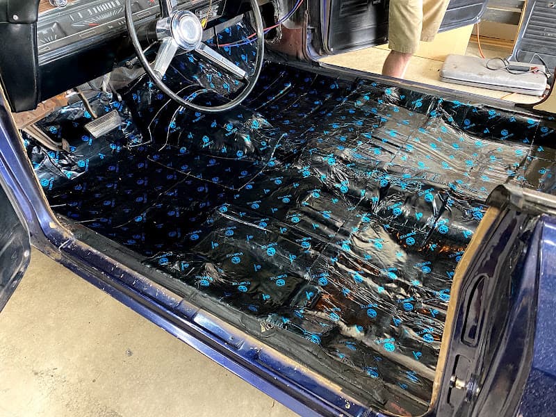 Sound deadening mat covering a car floor at Northwest Audio Suppliers in Sutherlin, Oregon