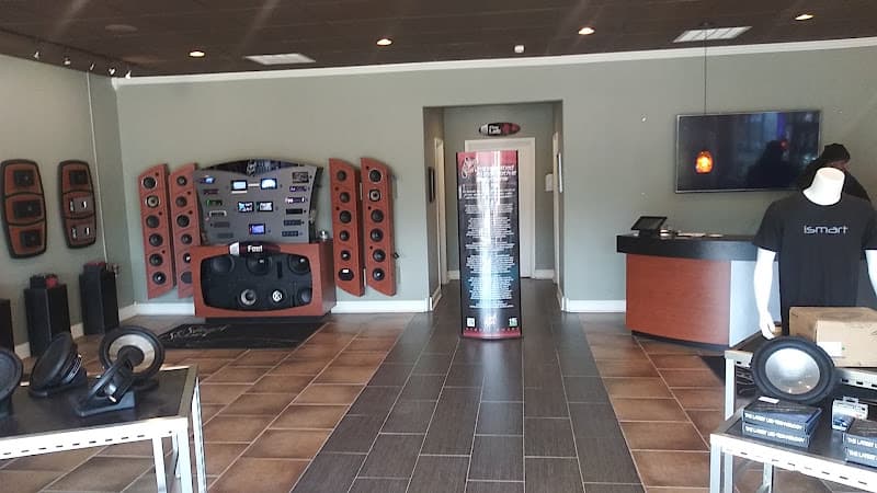 Showroom with speaker display towers and a subwoofer at Street Smart Automotive Enhancement in Flowood, Mississippi