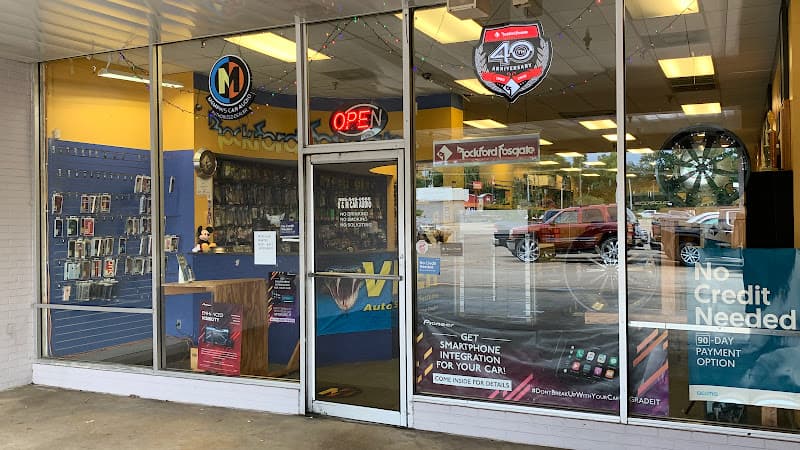 Storefront with glass windows and a No Credit Needed banner at S&M Car Audio in Hammond, Louisiana