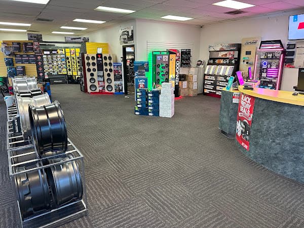 Showroom with wheel rims, speaker displays and a sales counter at Freeman's Car Stereo in Gastonia, North Carolina