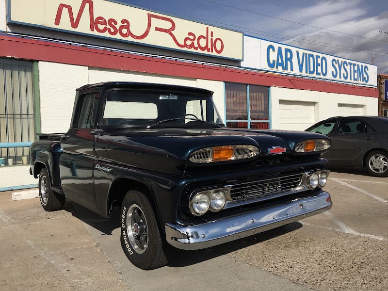 Chevrolet pickup truck parked in front of shop at Mesa Radio in Albuquerque, New Mexico