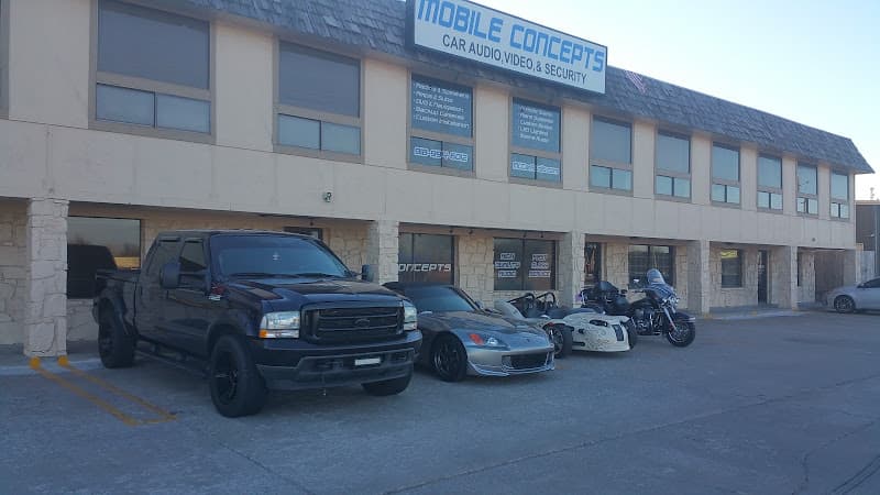 Storefront with pickup truck, sports car, and motorcycles outside at Mobile Concepts in Broken Arrow, Oklahoma
