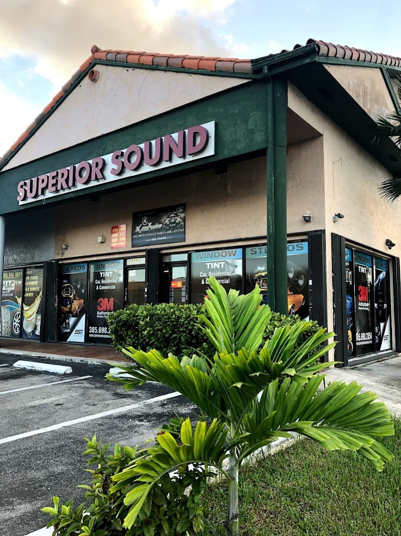 Storefront with tinted windows and Superior Sound sign at Superior Sound & Auto Accessories in Hialeah, Florida