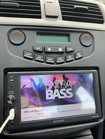 Sony touchscreen stereo in a dashboard with climate controls at Crazy Car Audio in College Park, Maryland