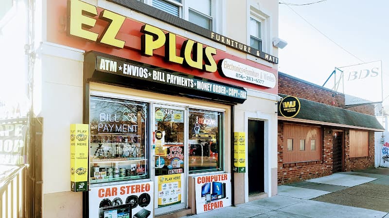 Storefront with a car stereo sign at EZ PLUS, WINDOW TINT, CAR AUDIO, ALARM & REMOTE STARTED in Camden, New Jersey