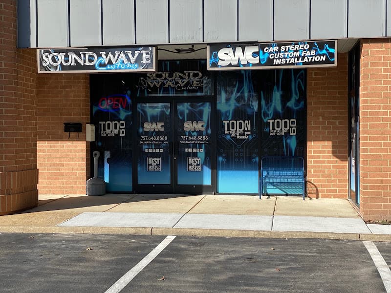 Storefront with blue graphic windows and two glass entry doors at Sound Wave Customs in Virginia Beach, Virginia