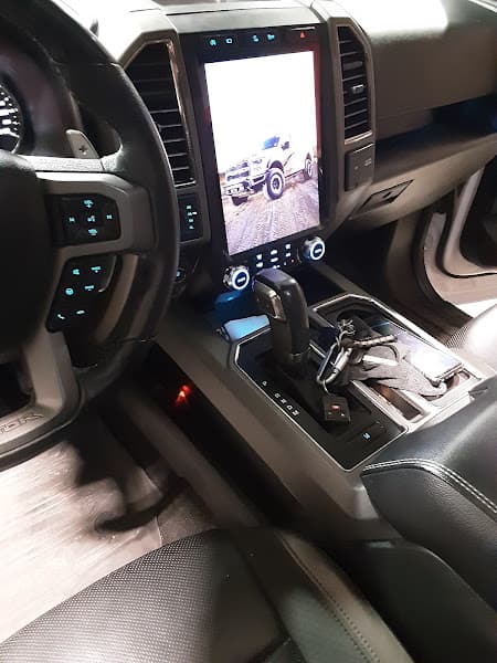 Truck interior with tall vertical touchscreen and gear shifter at LSA Laguna Sounds Audio LLC. in Wichita, Kansas