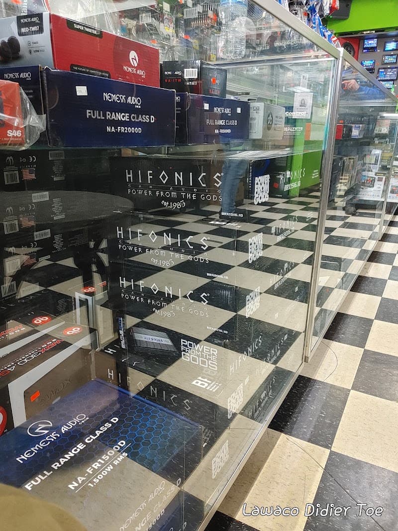 Glass case holding Hifonics and Nemesis Audio amplifier boxes at Electronics Guerrero in Chicago, Illinois