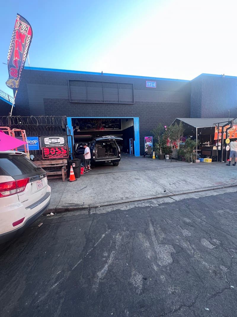 Shop front with open bay doors at Kano The Installer Car Stereo shop & windows tint Installation in Los Angeles, California