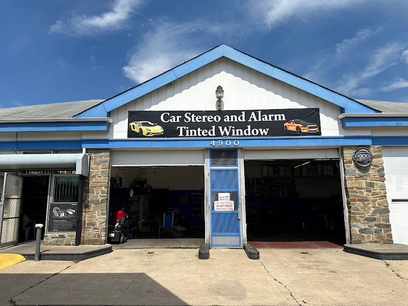 Storefront with two open bays and a car stereo banner at Discount Sounds and Security Inc in Oxon Hill, Maryland