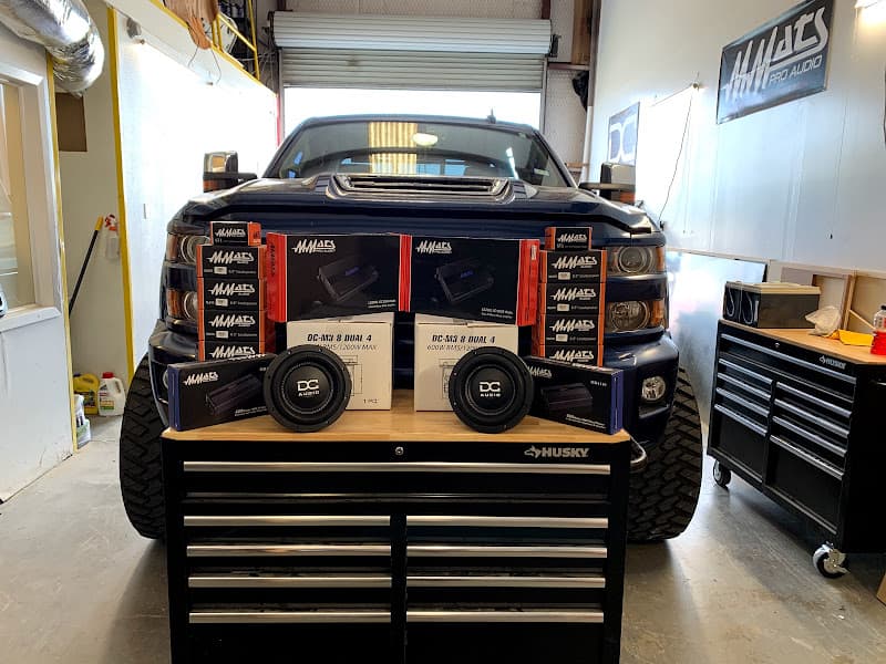 Pickup truck with DC Audio subwoofers and amplifier boxes on a toolbox at Elusive Audio in Georgetown, Texas