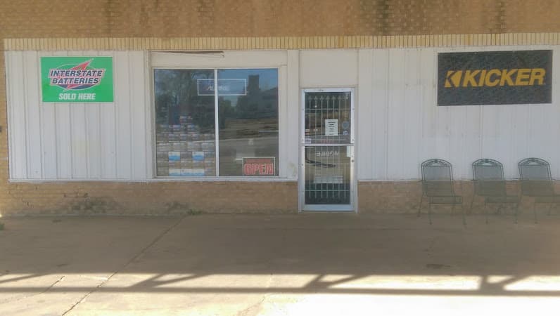 Storefront with Kicker and Interstate Batteries signs at Hall Auto Sound in Pampa, Texas