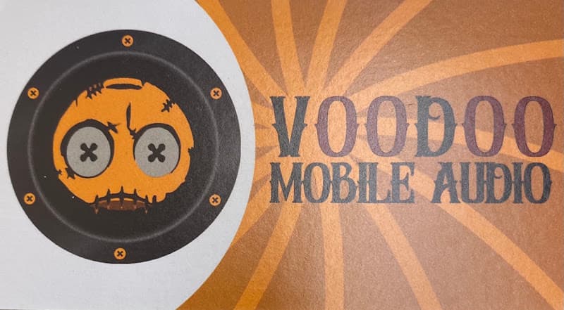 Business card with orange face inside black speaker logo at Voodoo Mobile Audio, LLC in Luling, Louisiana