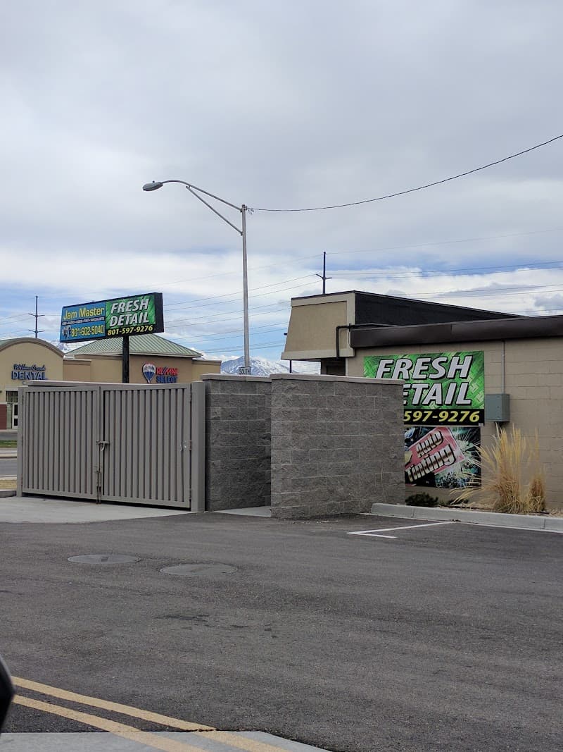 Roadside sign for Fresh Detail with phone numbers at Jam Master Car Audio/Video & Window Tinting in American Fork, Utah
