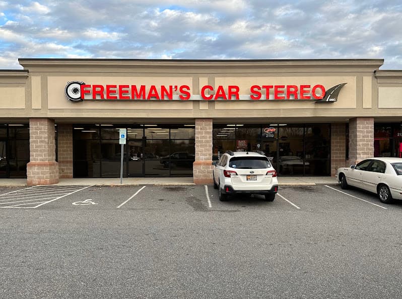 Storefront with red lettered sign and parked white SUV at Freeman's Car Stereo in Hickory, North Carolina