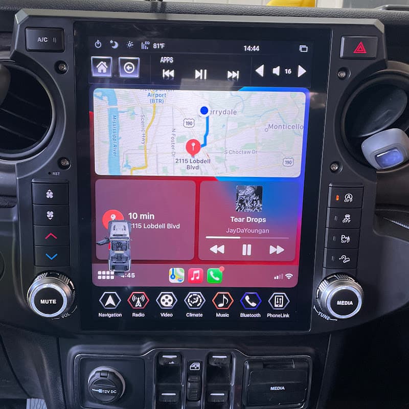 Vertical touchscreen showing a map and music player at Maximum Auto Works in Baton Rouge, Louisiana