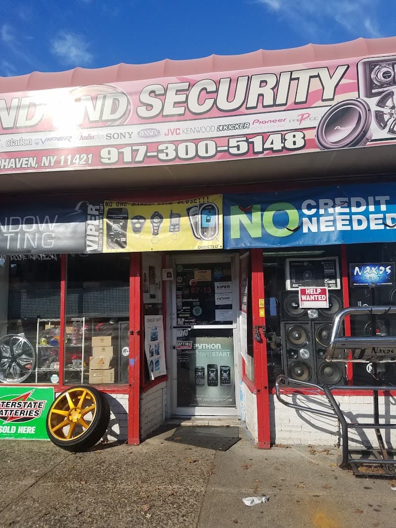 Storefront with car audio and security banners at New York Sound and Security in Woodhaven, New York