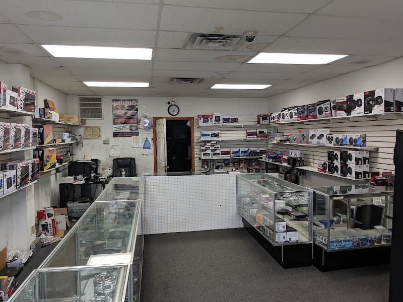 Store interior with glass cases, shelves of speaker boxes and a counter at Stereo Doctor in Cincinnati, Ohio