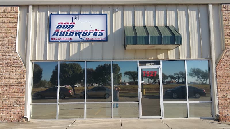 Storefront with a lit sign, tinted windows and a green awning at 806 Autoworks in Amarillo, Texas