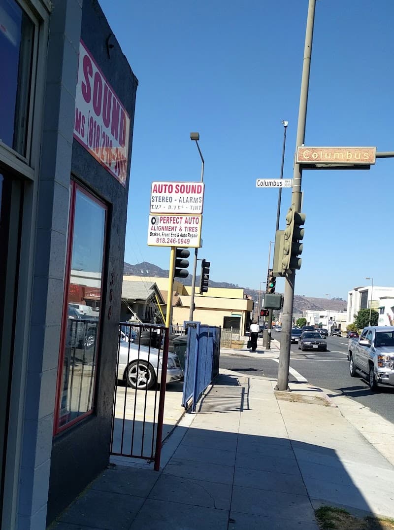 Storefront with auto sound sign beside a Columbus Avenue street sign at Glendale Auto Sound in Glendale, California