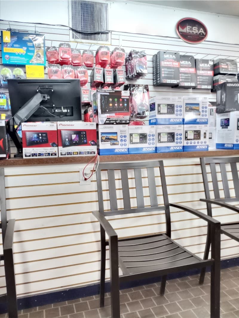 Showroom counter with Pioneer and Jensen head unit boxes at Driver's Edge Car Audio in Lubbock, Texas