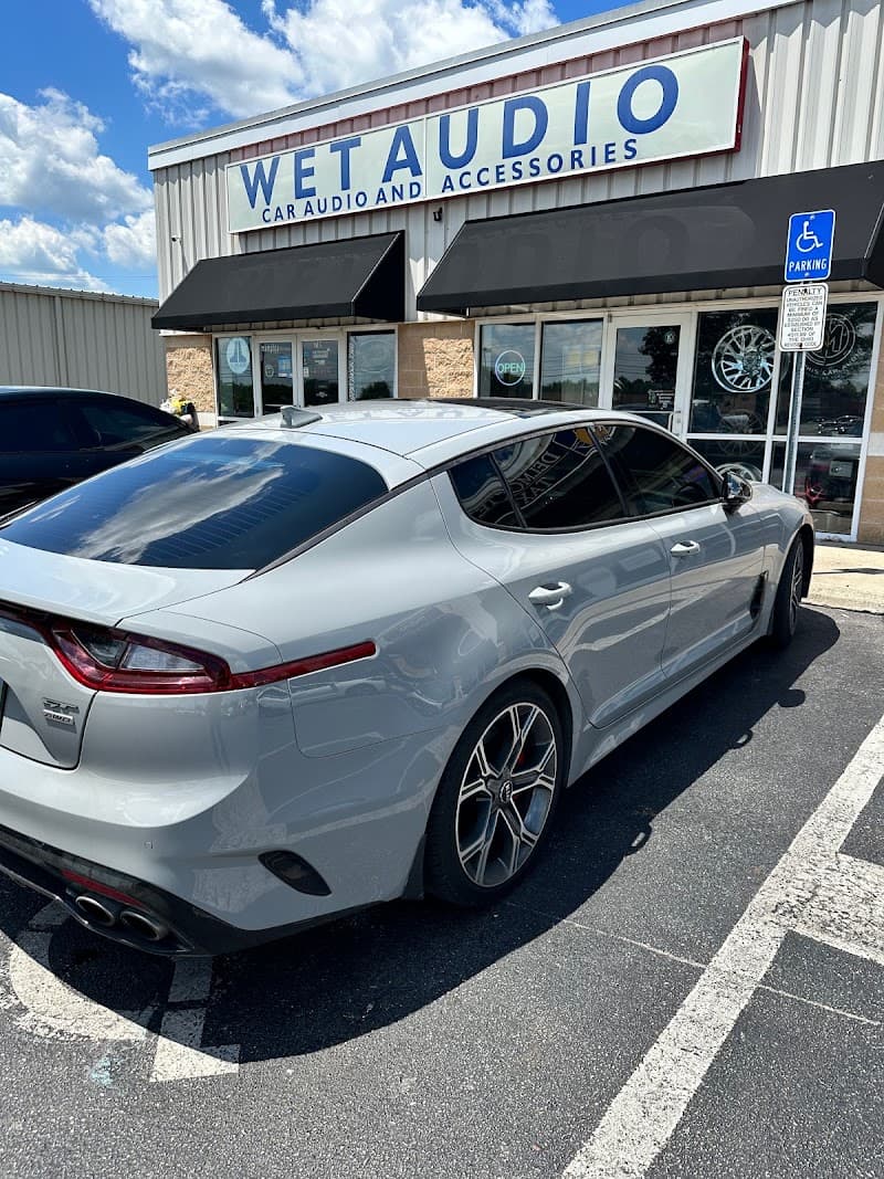 Gray sedan parked in front of storefront at Wet Audio & Accessories Inc in Columbus, Ohio