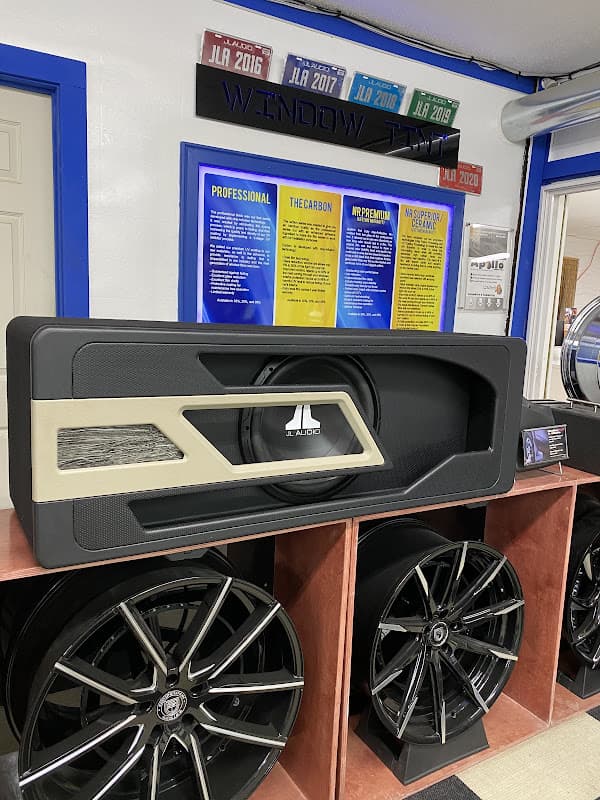 Subwoofer enclosure with JL Audio logo on a display shelf at Underground Customs in Odessa, Texas