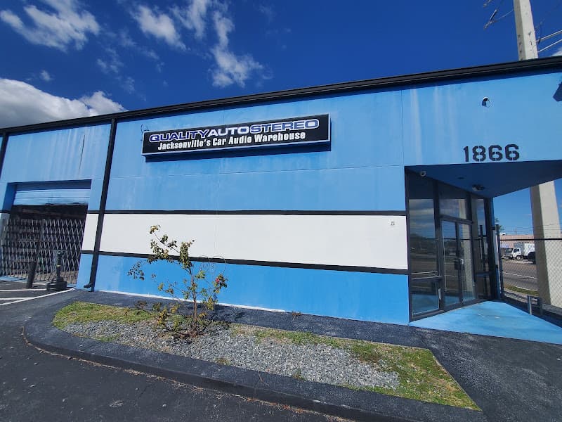 Blue storefront with glass entry doors at Quality Auto Stereo Jacksonville's Car Audio Warehouse ™ in Jacksonville, Florida